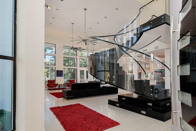 a living room with couch and a chandelier