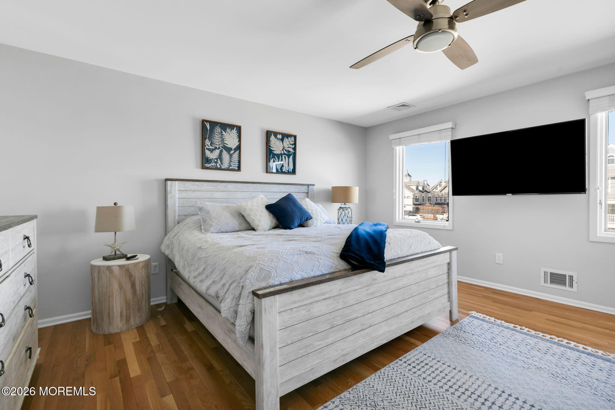 327 Tide Pond Road Mantoloking, NJ 08738 - Photo 25 of 45 a bedroom with a bed and a flat screen tv