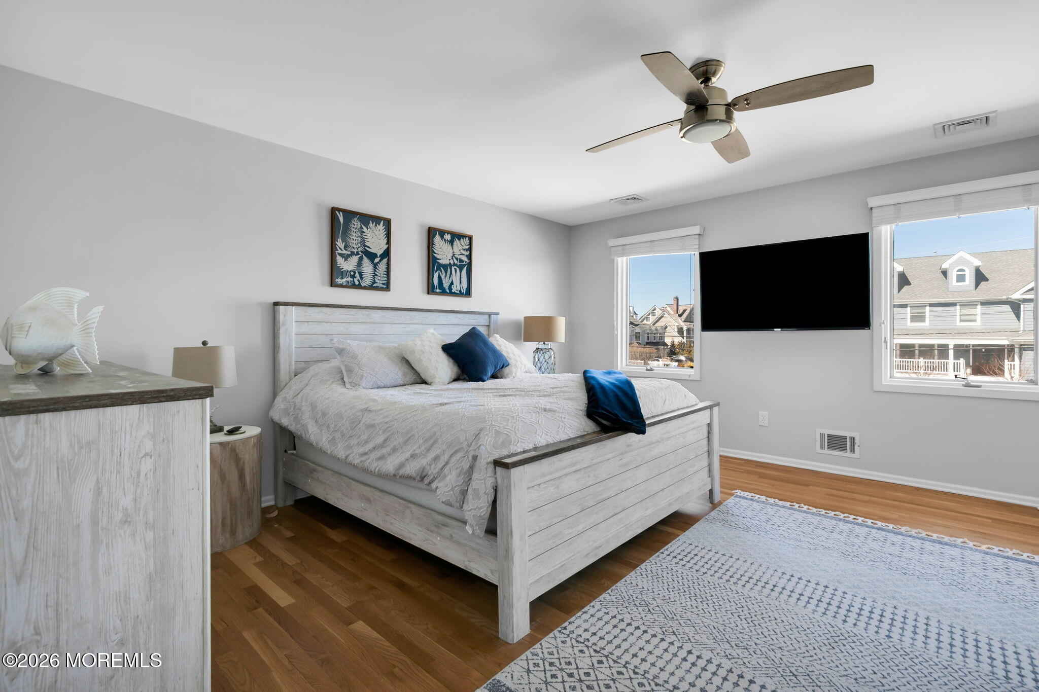 327 Tide Pond Road Mantoloking, NJ 08738 - Photo 27 of 45 a bedroom with a bed and a flat screen tv