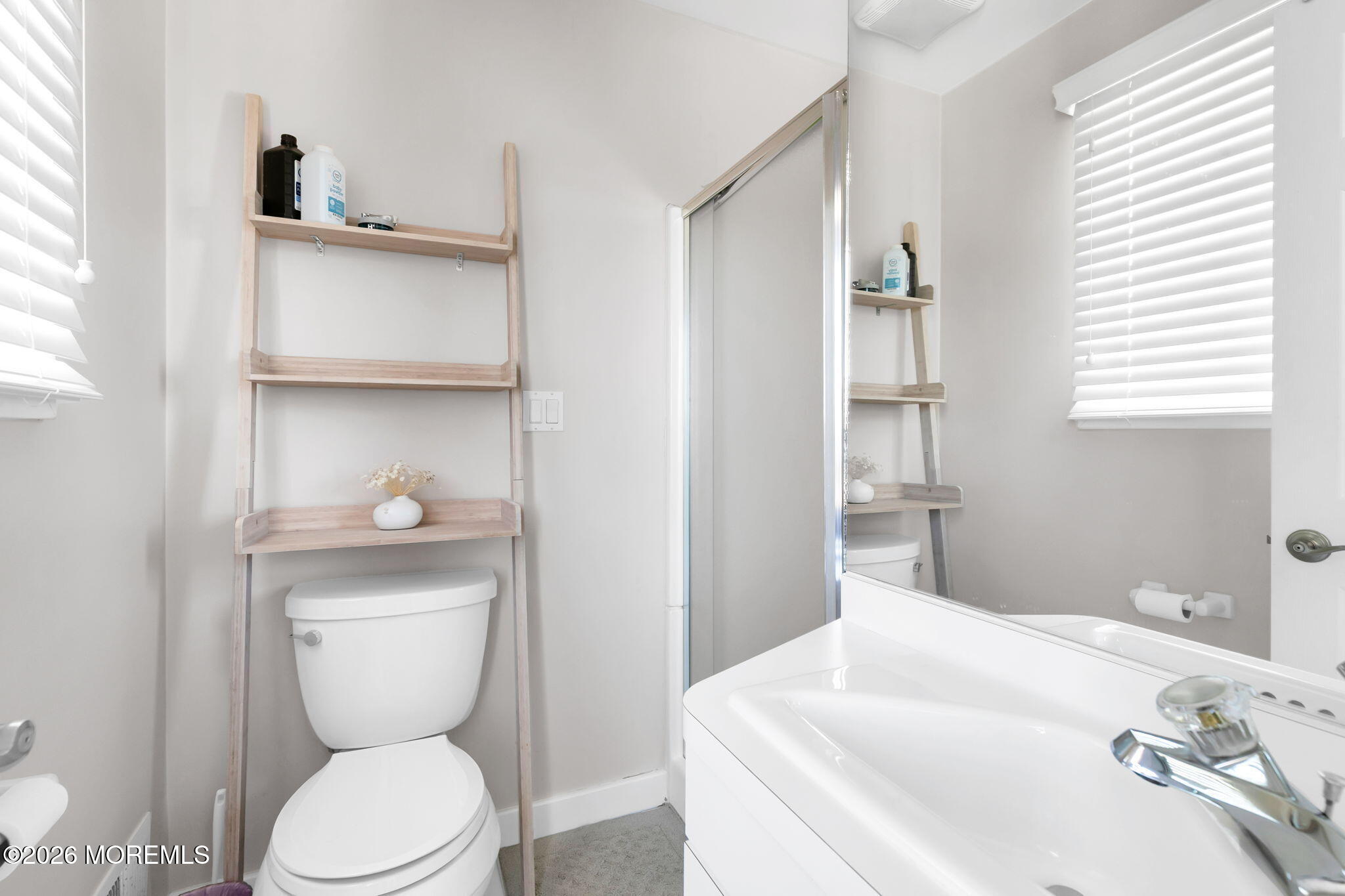 327 Tide Pond Road Mantoloking, NJ 08738 - Photo 28 of 45 a bathroom with a sink a toilet and shower