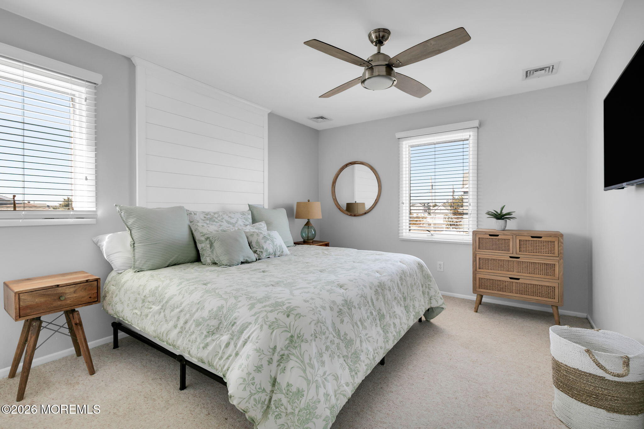 327 Tide Pond Road Mantoloking, NJ 08738 - Photo 29 of 45 a bedroom with a bed and a flat screen tv