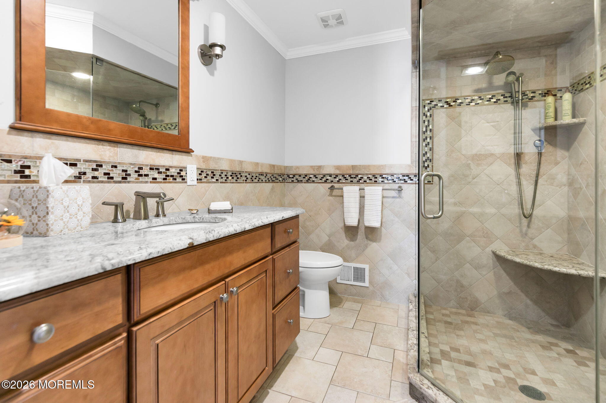 327 Tide Pond Road Mantoloking, NJ 08738 - Photo 31 of 45 a bathroom with a sink a toilet and shower