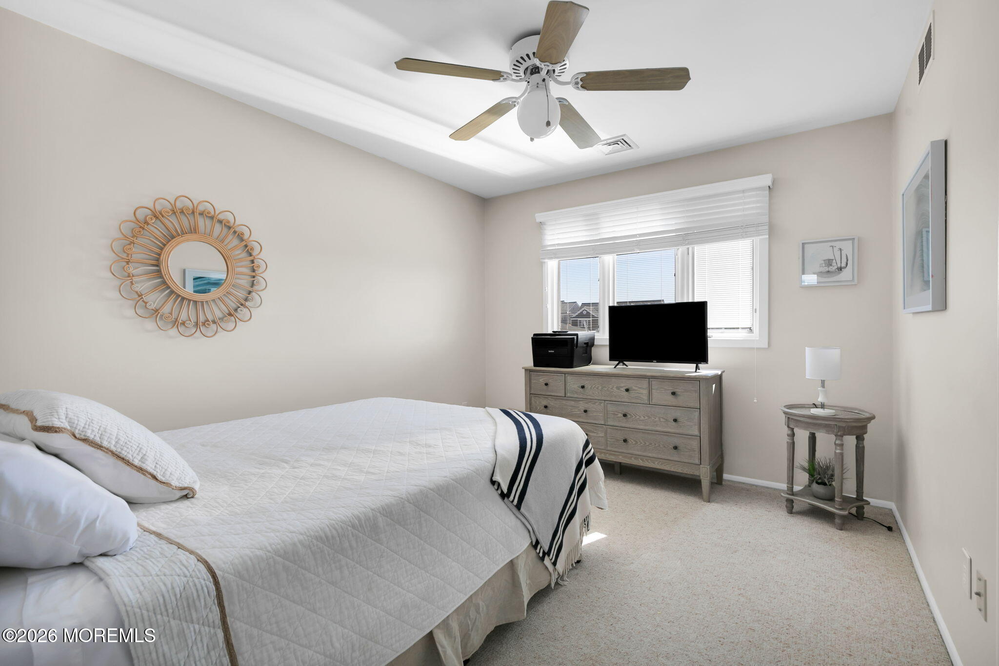 327 Tide Pond Road Mantoloking, NJ 08738 - Photo 32 of 45 a bedroom with a bed a flat screen tv and dresser