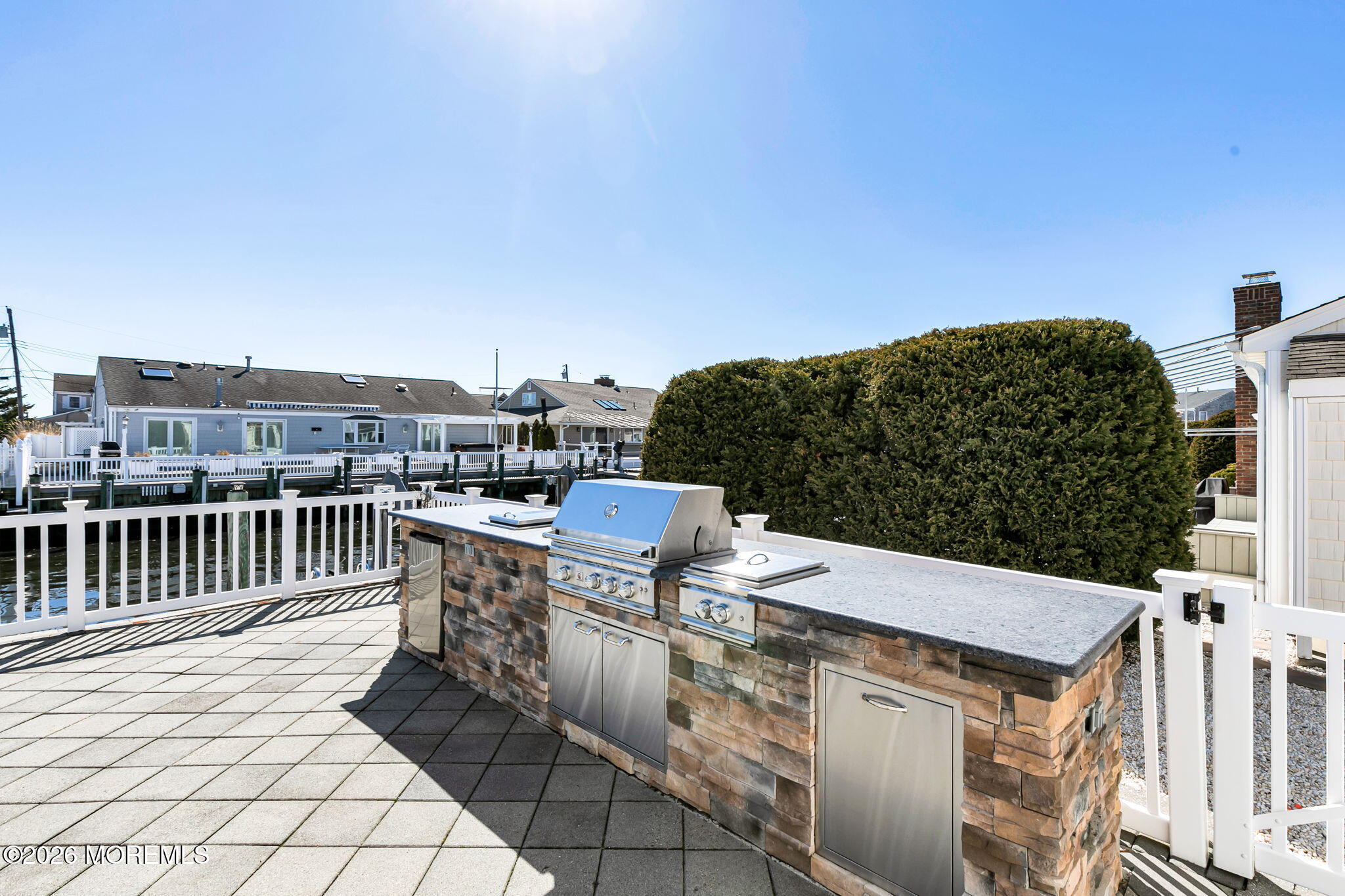 327 Tide Pond Road Mantoloking, NJ 08738 - Photo 36 of 45 a view of a terrace with a bench