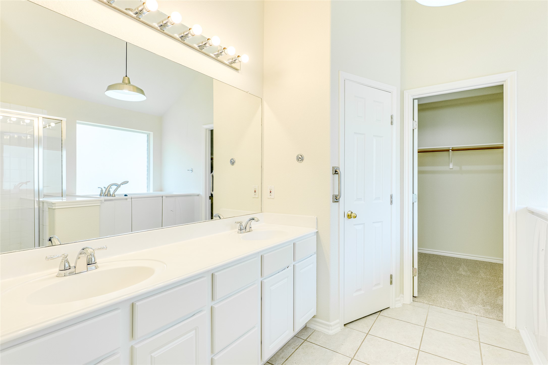 111 Arrowhead Lane Georgetown, TX 78628 - Photo 26 of 40 a spacious bathroom with a double vanity sink mirror and