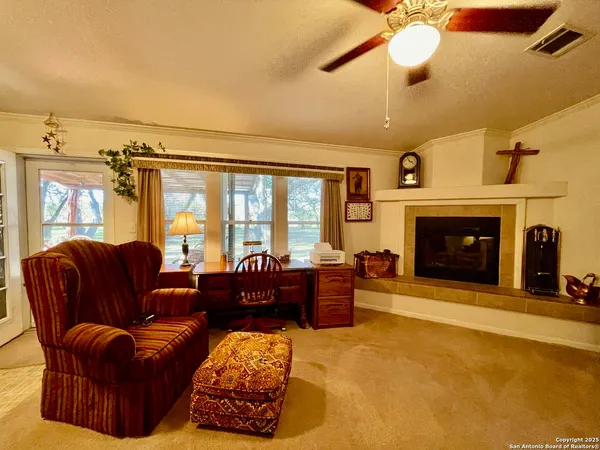 a kitchen with a sink a stove top oven a counter space and cabinets