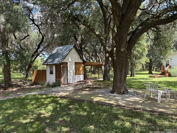 a backyard of a house with lots of green space