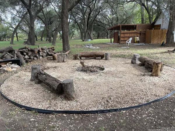a view of a backyard with sitting area