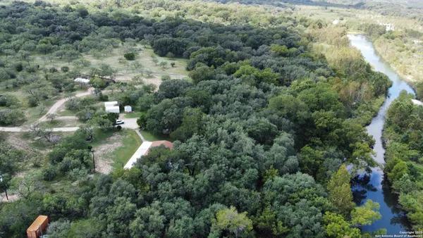 a view of a dining room with furniture and a window