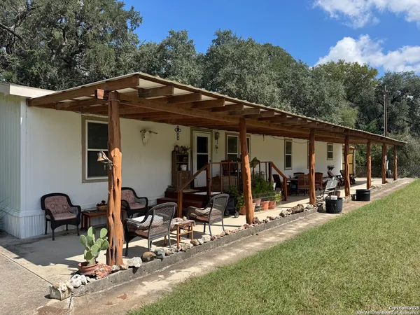 a living room with furniture flat screen tv and a fireplace