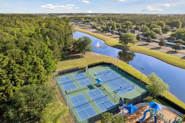 an aerial view of a house with a swimming pool yard and outdoor seating