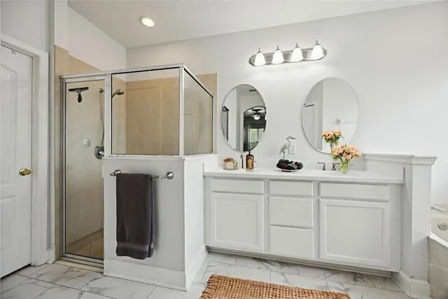 a bedroom with a bed and a potted plant