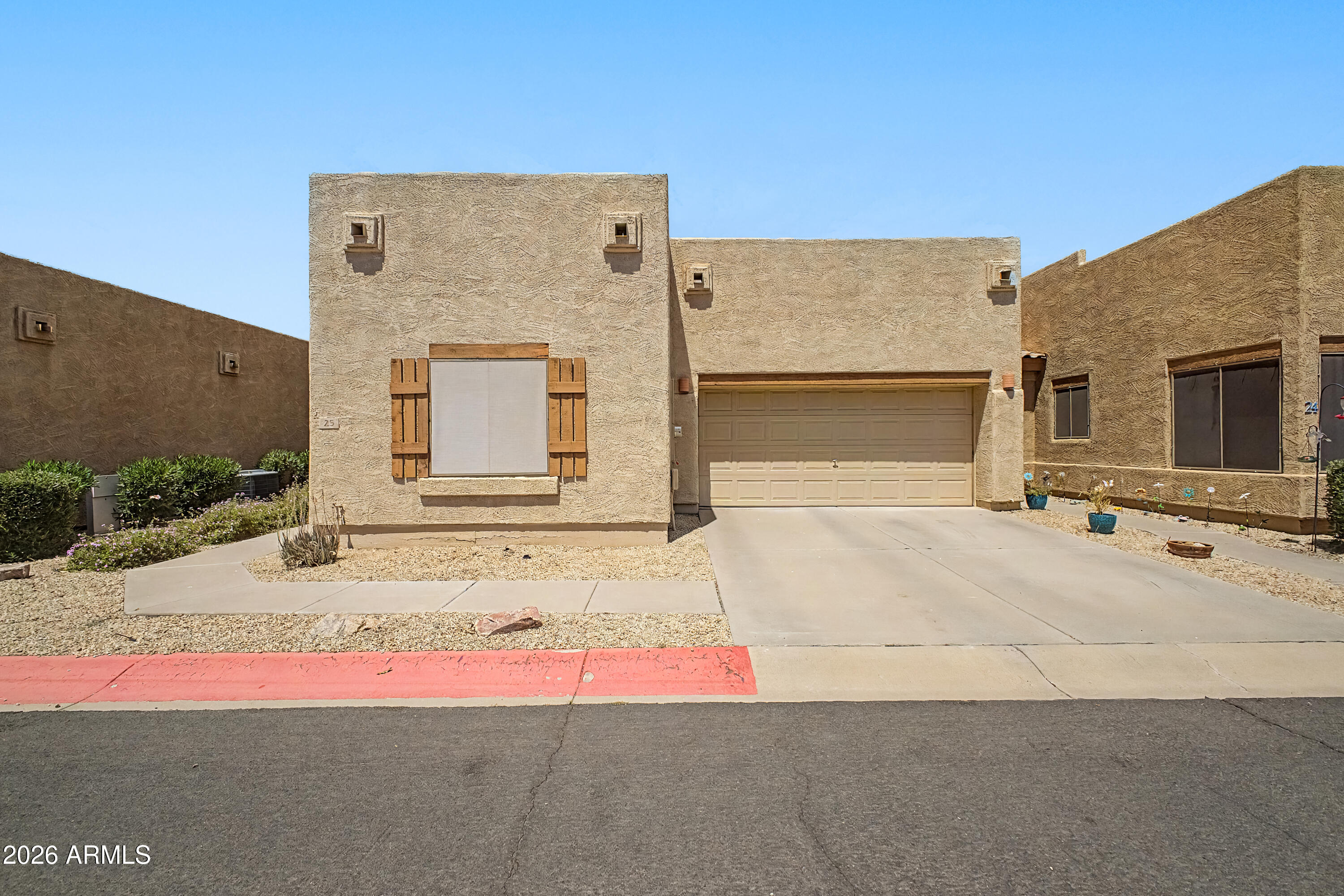 1650 South Crismon Road, Unit 25 Mesa, AZ 85209 - Photo 1 of 33 a house view with a outdoor space