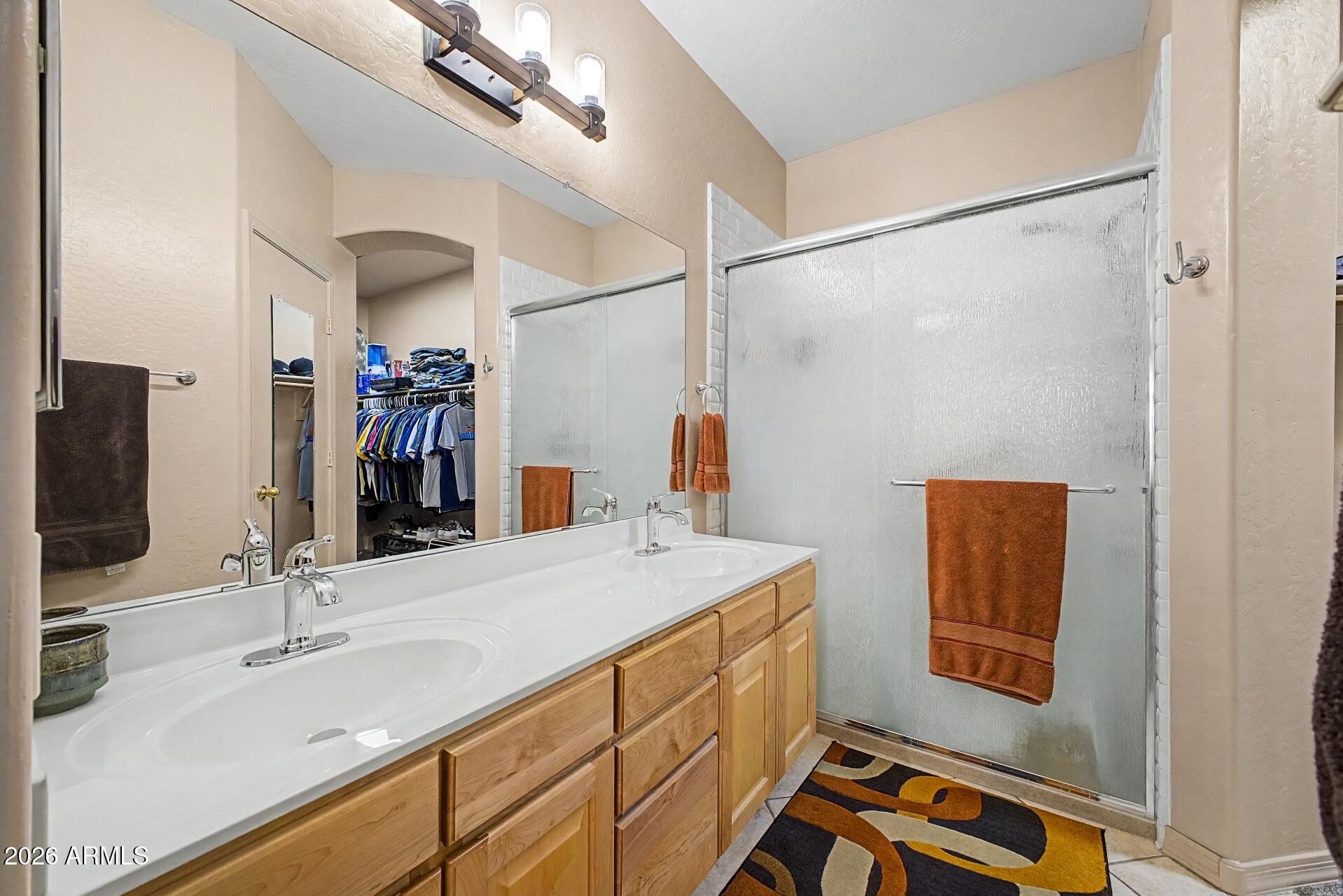 1650 South Crismon Road, Unit 25 Mesa, AZ 85209 - Photo 19 of 33 a bathroom with a sink and a mirror