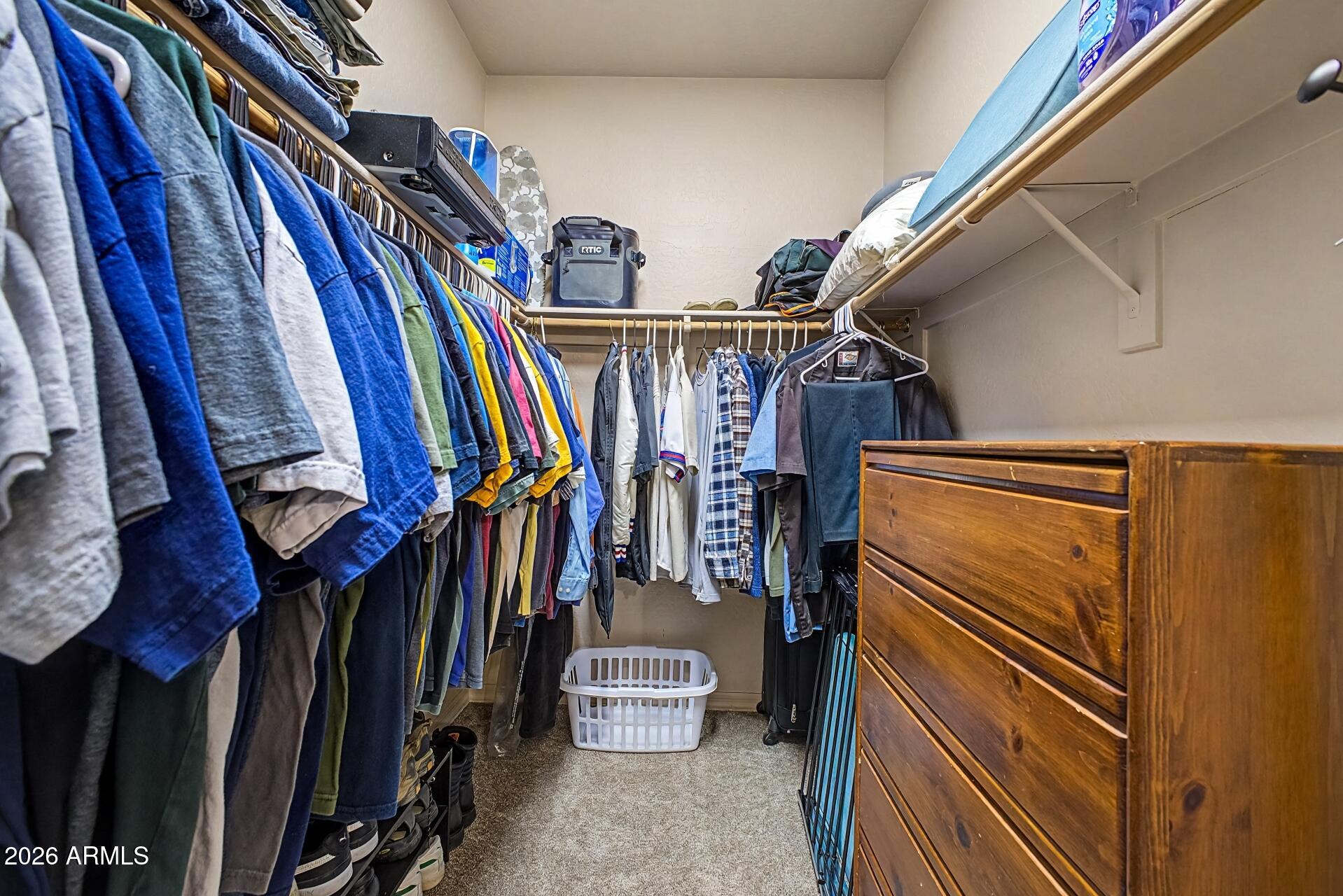 1650 South Crismon Road, Unit 25 Mesa, AZ 85209 - Photo 20 of 33 a view of walk in closet with clothes and shoes