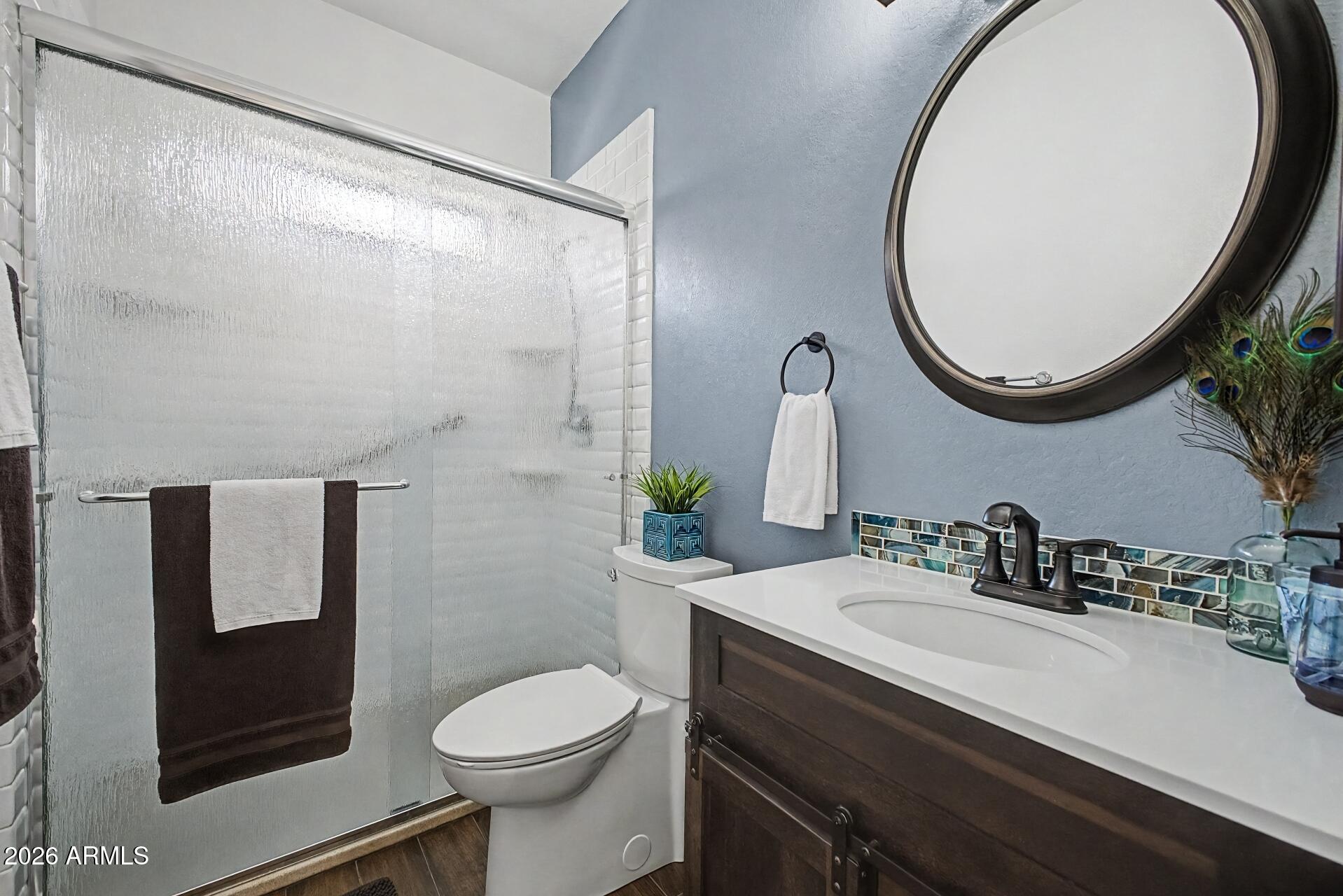 1650 South Crismon Road, Unit 25 Mesa, AZ 85209 - Photo 23 of 33 a bathroom with a sink and a mirror