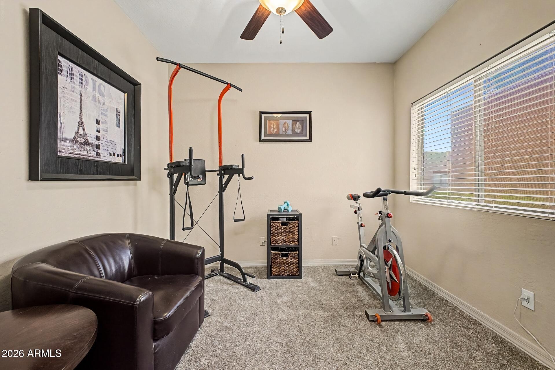 1650 South Crismon Road, Unit 25 Mesa, AZ 85209 - Photo 24 of 33 a view of a livingroom with furniture and a window