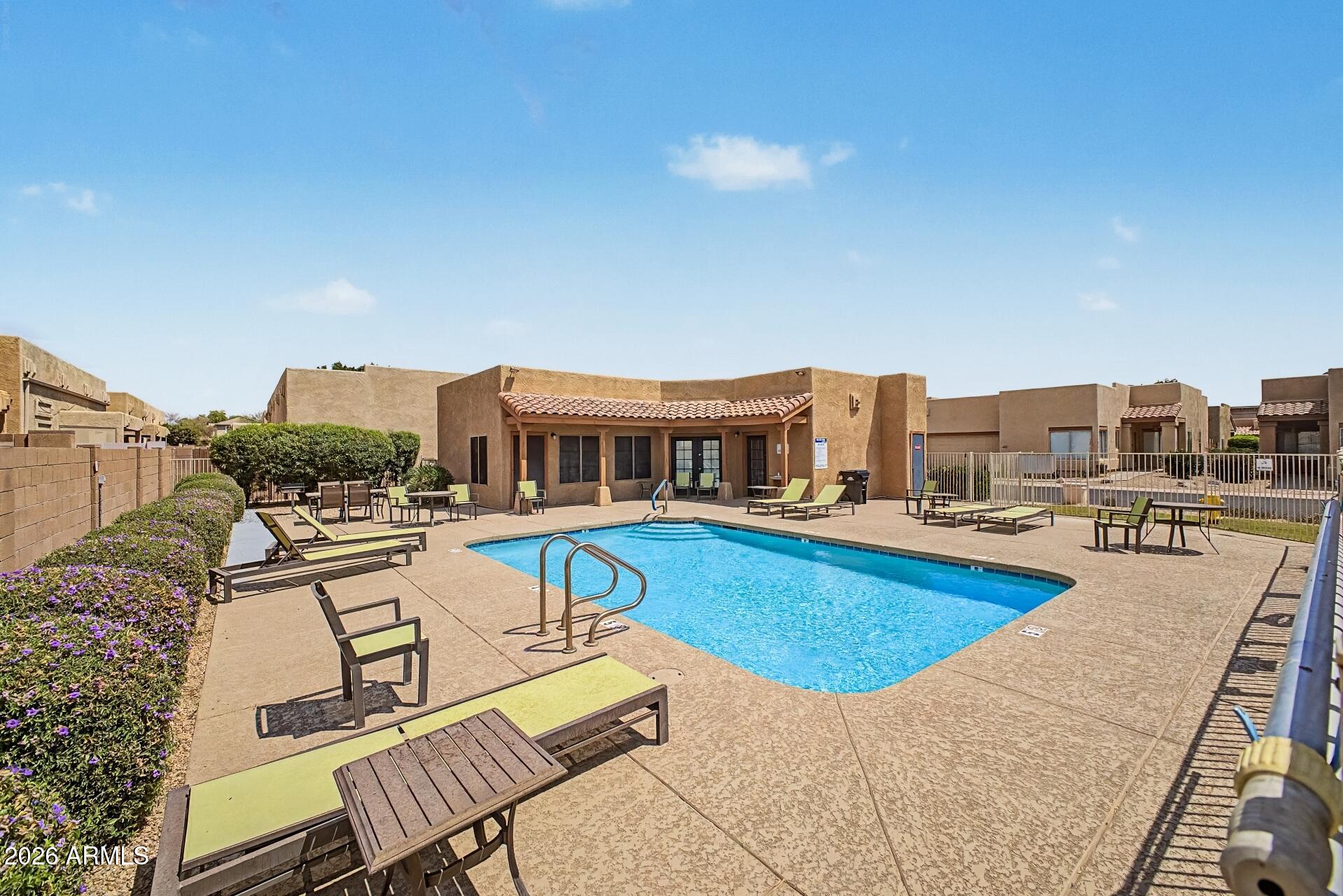 1650 South Crismon Road, Unit 25 Mesa, AZ 85209 - Photo 32 of 33 a view of a patio with swimming pool