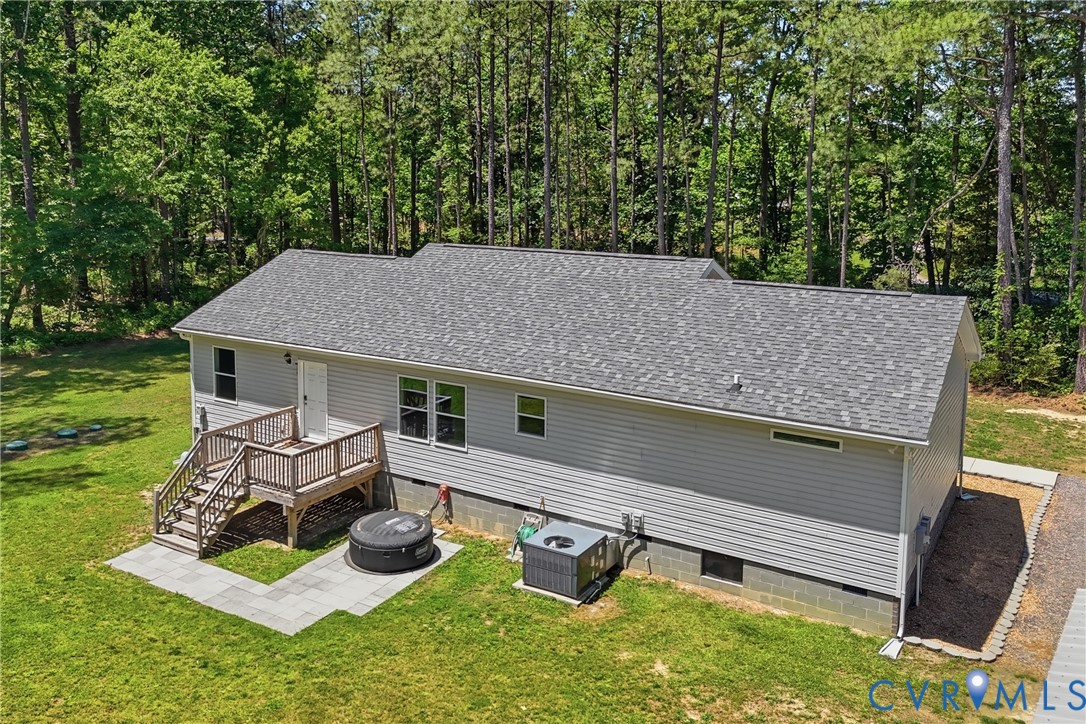 93 Faraway Road Saluda, VA 23149 - Photo 53 of 58 an aerial view of a house roof deck with chairs and a yard