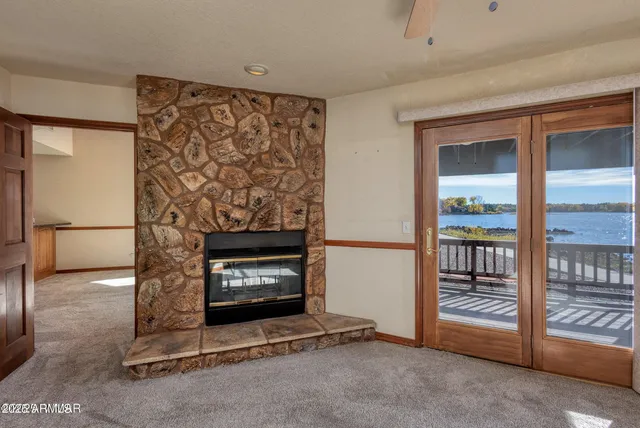 a view of an empty room and fire place