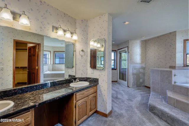 a bathroom with a bathtub and a sink