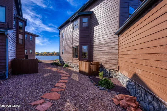 an aerial view of a house with a lake view