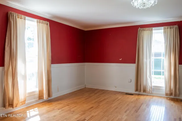 a view of hallway with wooden floor