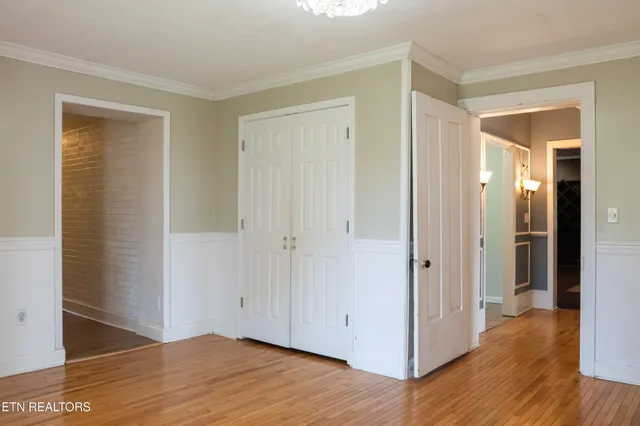 a bathroom with a sink mirror and toilet