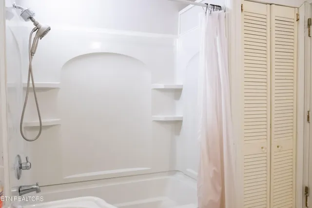 a view of an empty walk in closet