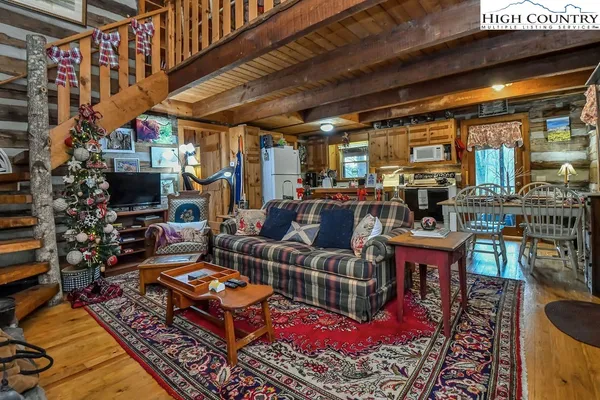 a living room with lots of furniture and a fireplace