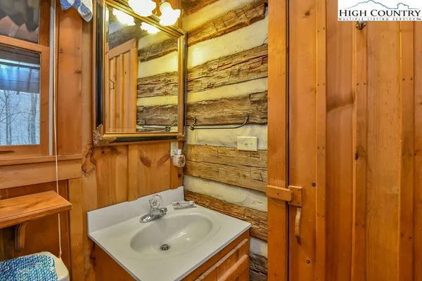 a bathroom with a sink and mirror