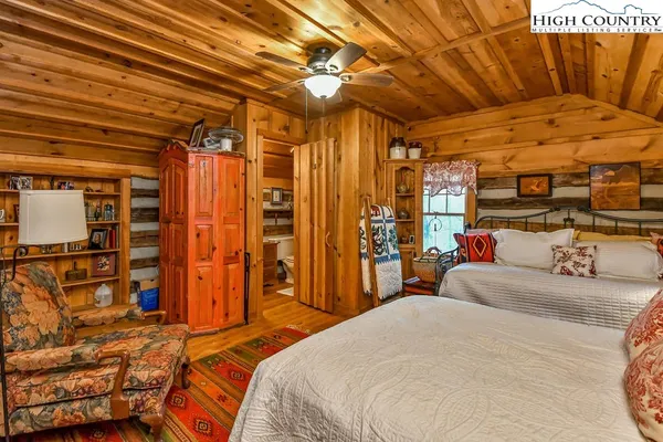 a bedroom with a bed and a walk in closet