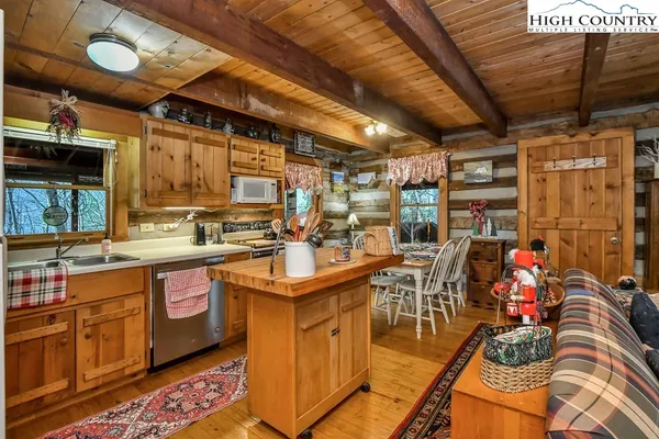 a kitchen with stainless steel appliances granite countertop a sink and cabinets