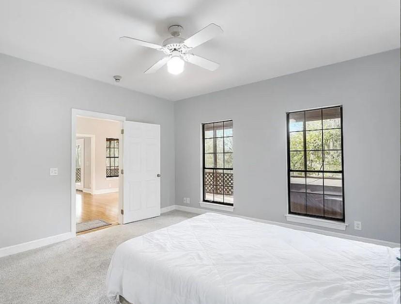 1525 Black Island Road Darien, GA 31305 - Photo 20 of 41 a bedroom with a large bed and a window