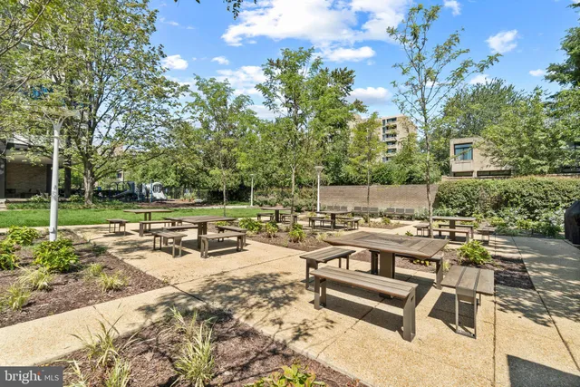 a view of a backyard with sitting area