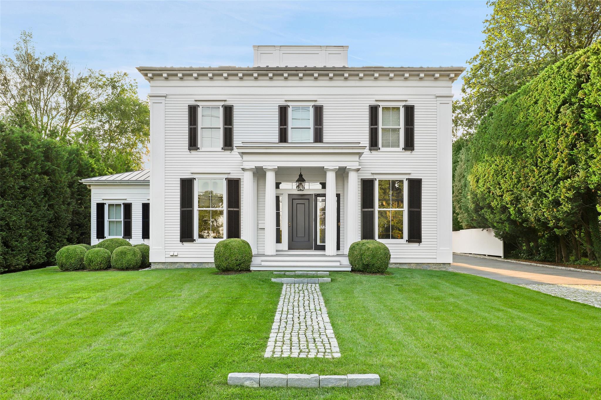 590 Forest Avenue Rye, NY 10580 - Photo 1 of 1 a front view of a house with garden