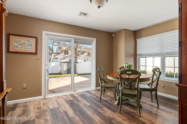 a view of a dining room with furniture and window