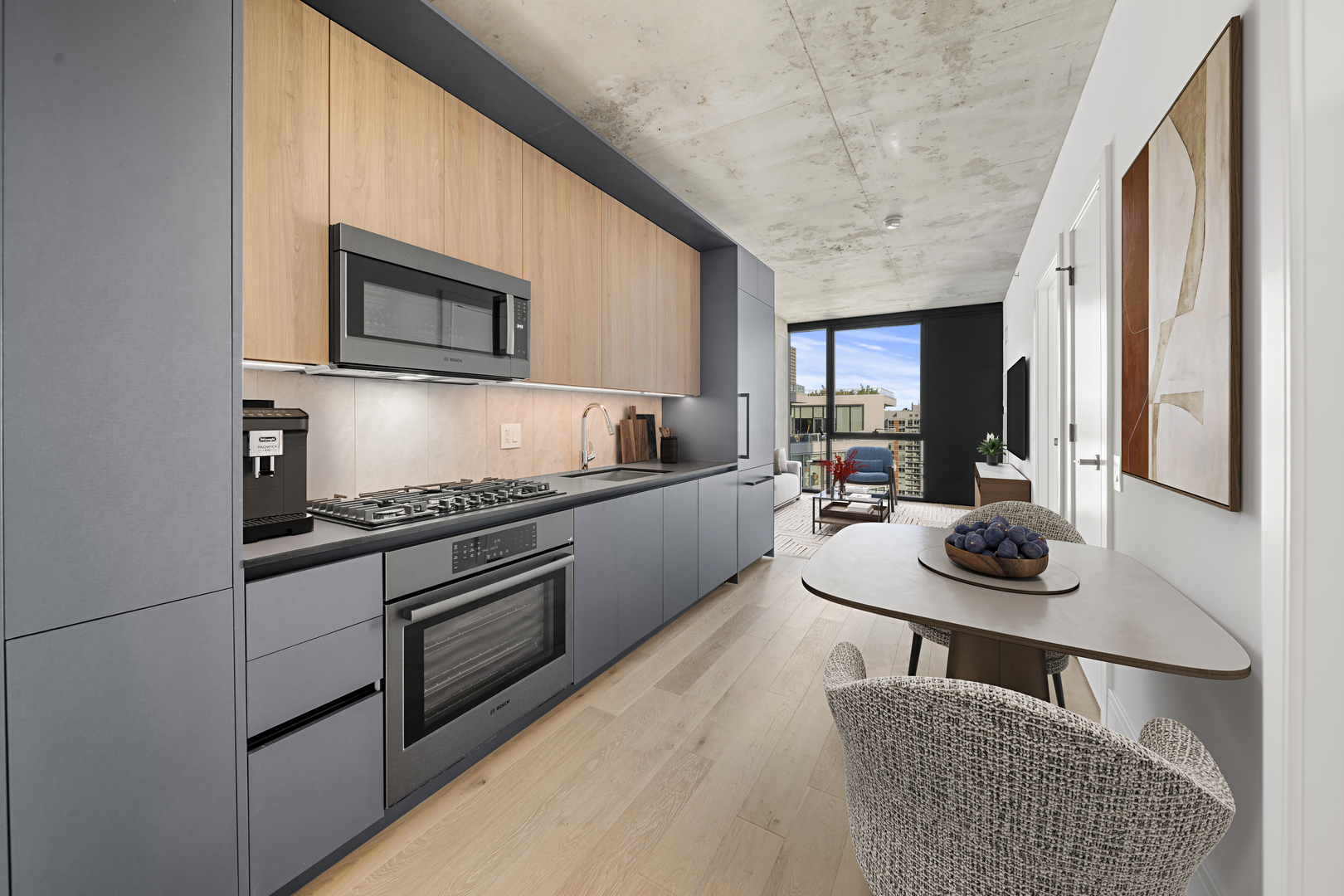 234 West Polk Street, Unit 3411 Chicago, IL 60607 - Photo 2 of 37 a kitchen with stainless steel appliances granite countertop a sink and a microwave