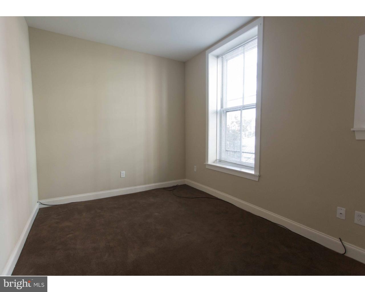 1100 Spruce Street, Unit 2B Philadelphia, PA 19107 - Photo 11 of 22 a view of an empty room with a window