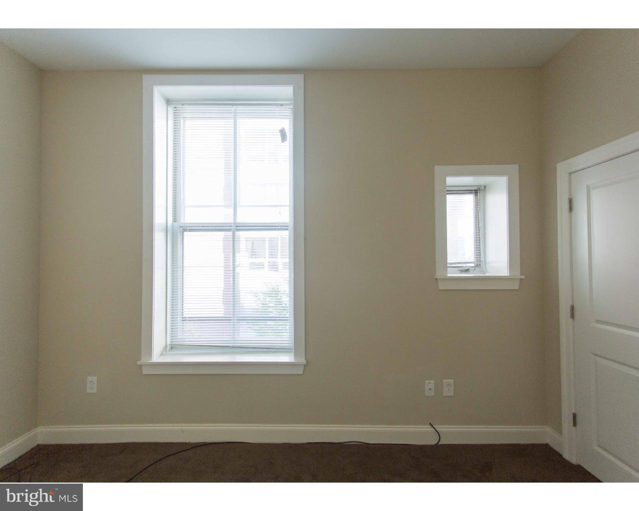 1100 Spruce Street, Unit 2B Philadelphia, PA 19107 - Photo 13 of 22 a view of an empty room with a window
