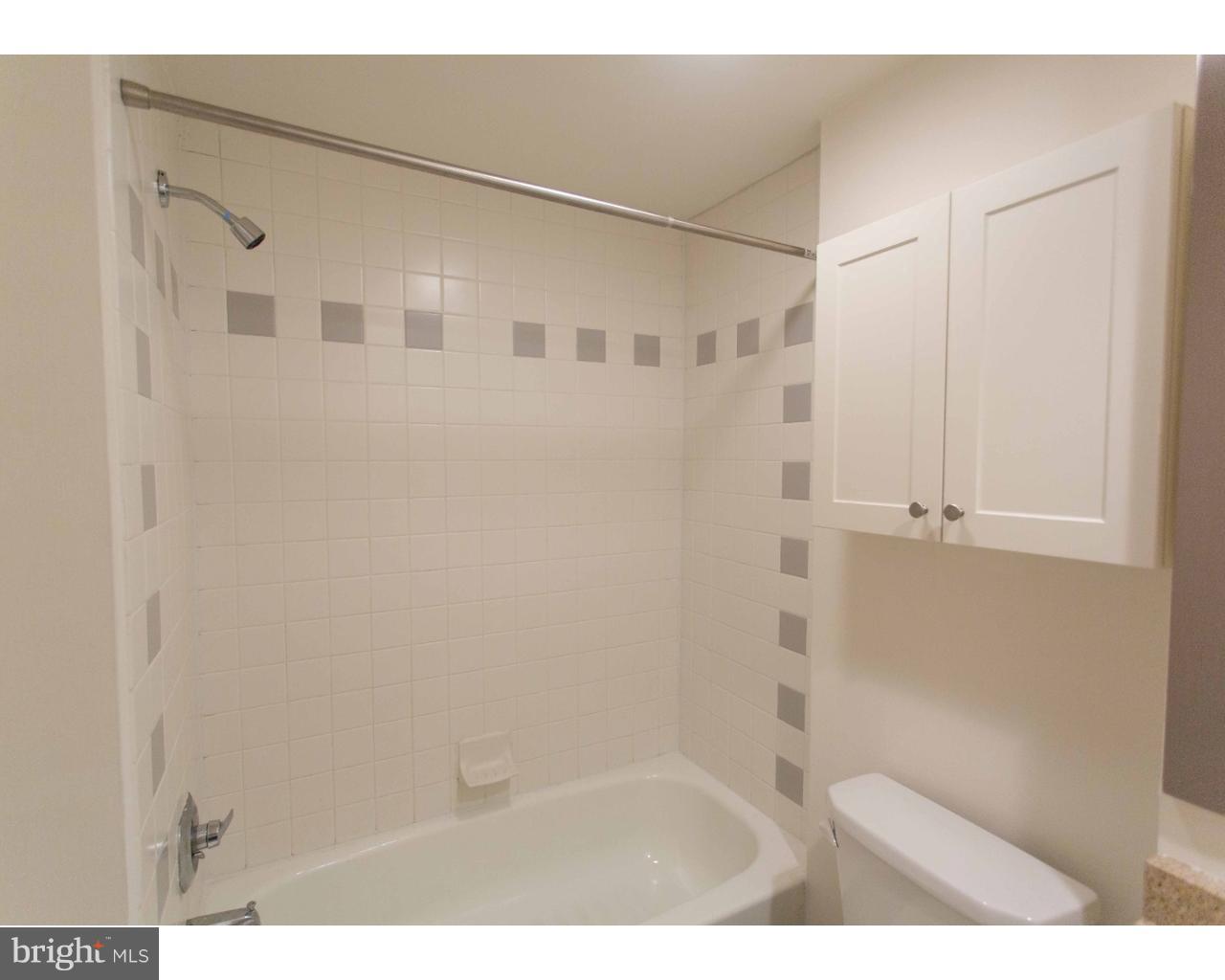 1100 Spruce Street, Unit 2B Philadelphia, PA 19107 - Photo 14 of 22 a bathroom with a shower and a glass door