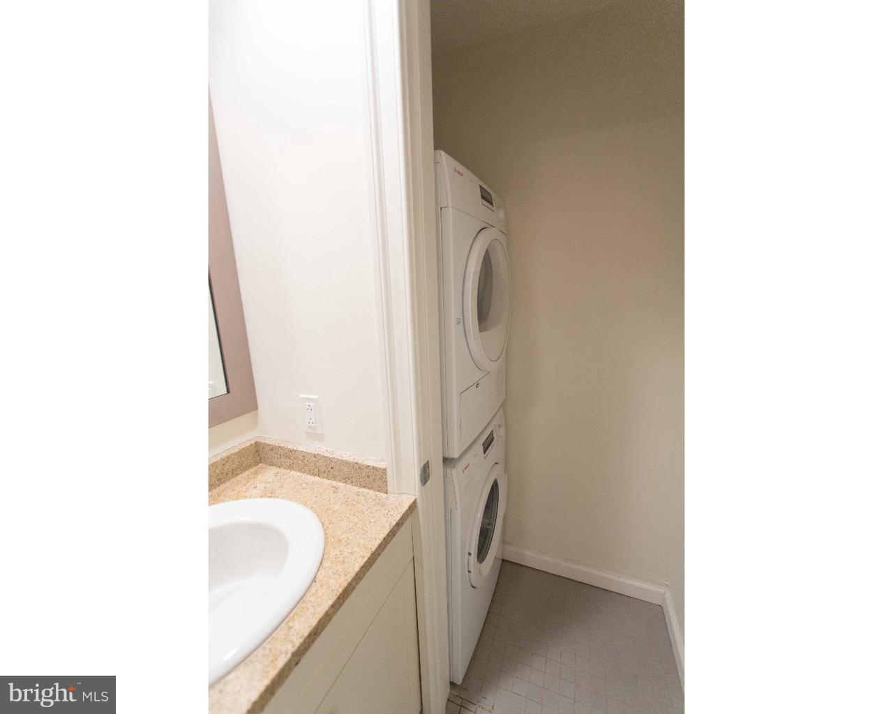 1100 Spruce Street, Unit 2B Philadelphia, PA 19107 - Photo 10 of 22 a bathroom with a granite countertop sink and a mirror
