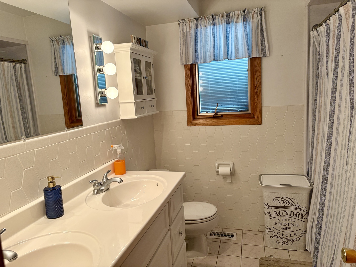 5600 St Charles Road Berkeley, IL 60163 - Photo 18 of 25 a bathroom with a sink toilet and mirror