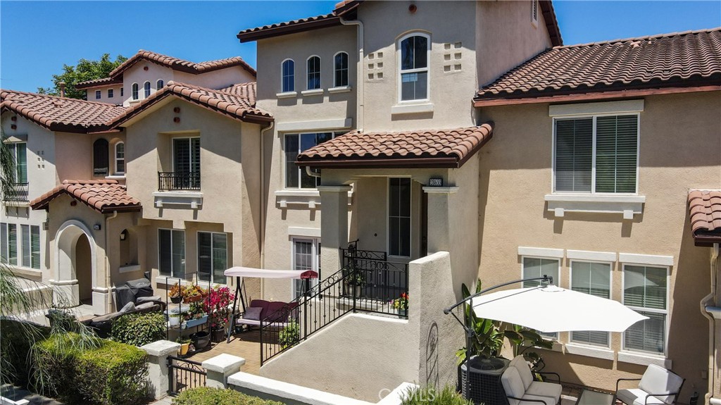 28653 Bar Harbor Lane Temecula, CA 92591 - Photo 1 of 1 a front view of a house with a garden and plants