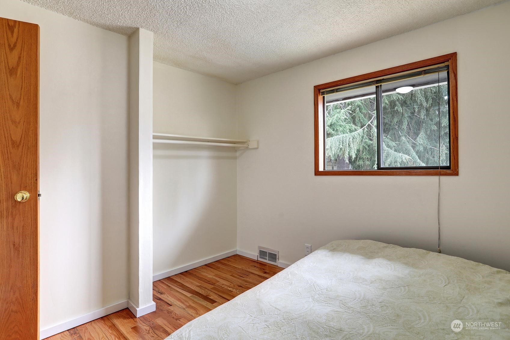 237 South 197th Street Des Moines, WA 98148 - Photo 14 of 29 a bedroom with a bed and a window