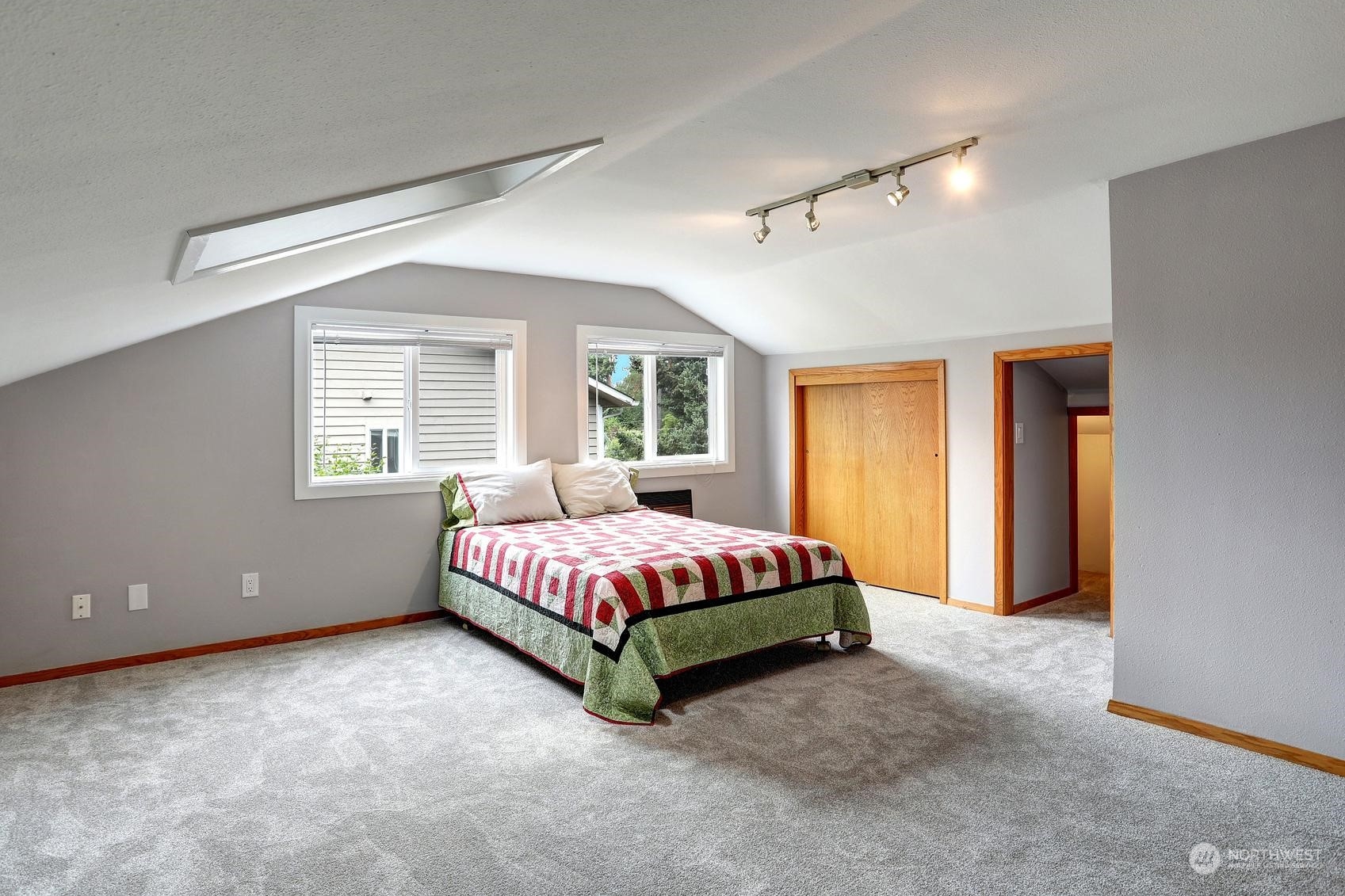 237 South 197th Street Des Moines, WA 98148 - Photo 16 of 29 a spacious bedroom with a bed and a couch