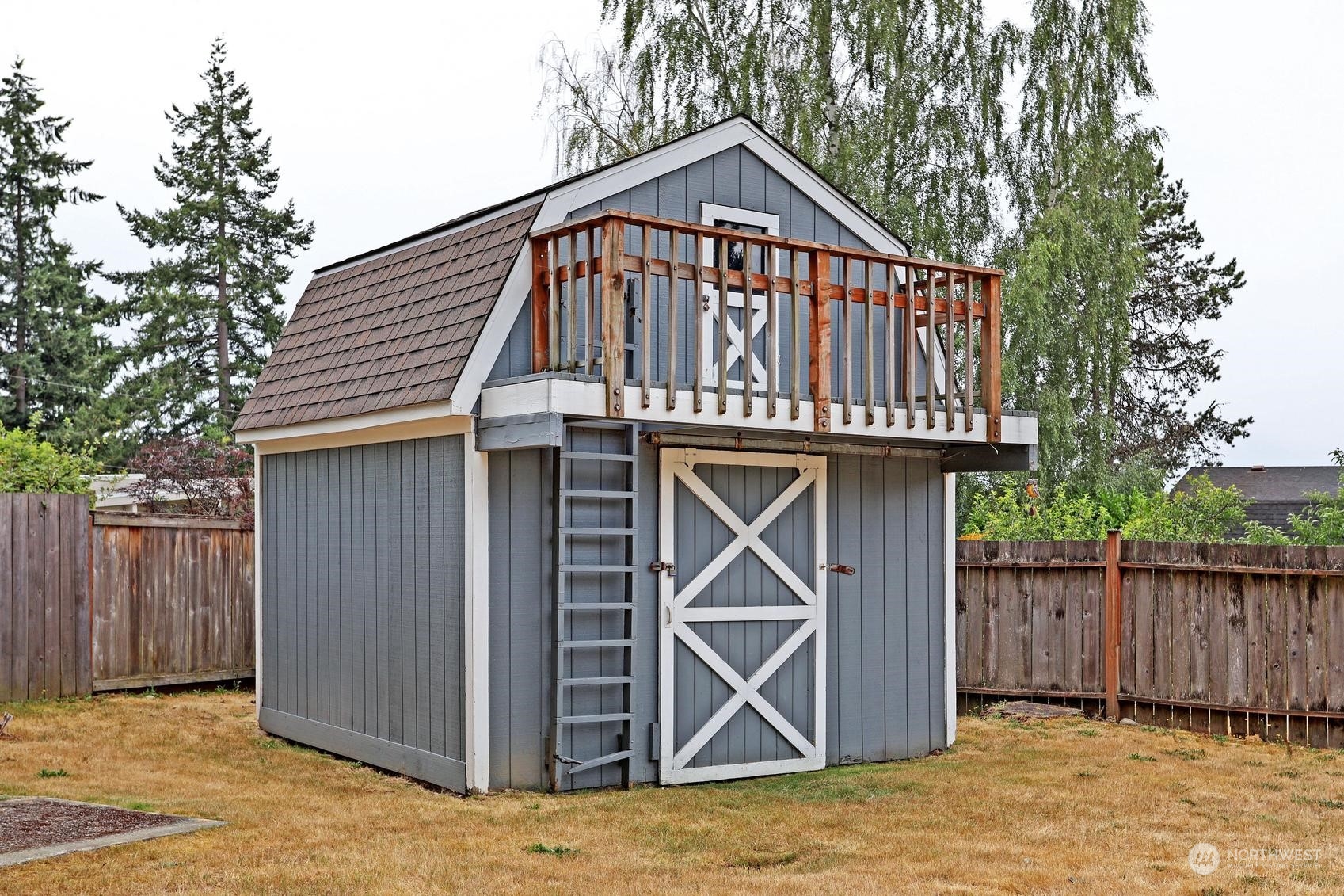 237 South 197th Street Des Moines, WA 98148 - Photo 26 of 29 a front view of a house with wooden fence