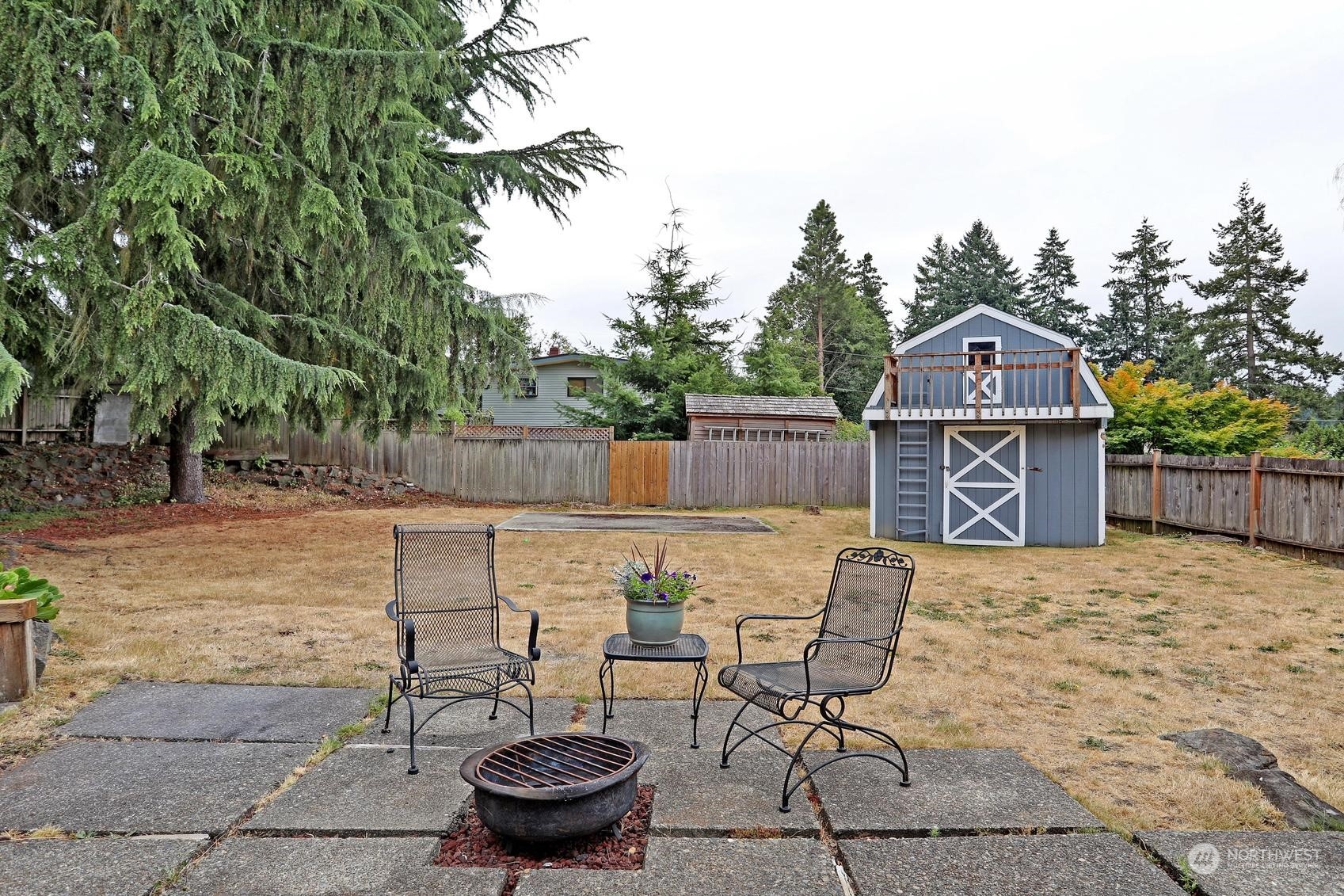 237 South 197th Street Des Moines, WA 98148 - Photo 28 of 29 a view of a chairs and table in backyard