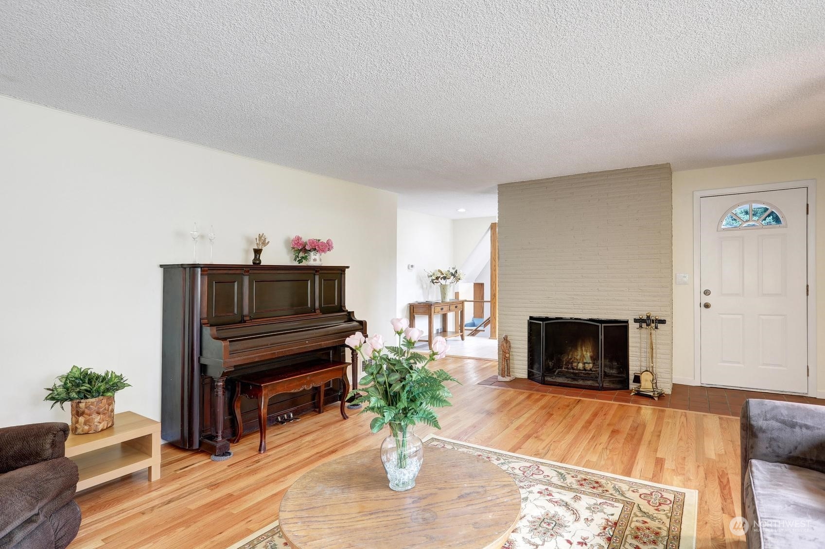 237 South 197th Street Des Moines, WA 98148 - Photo 7 of 29 a living room with furniture a fireplace and a potted plant