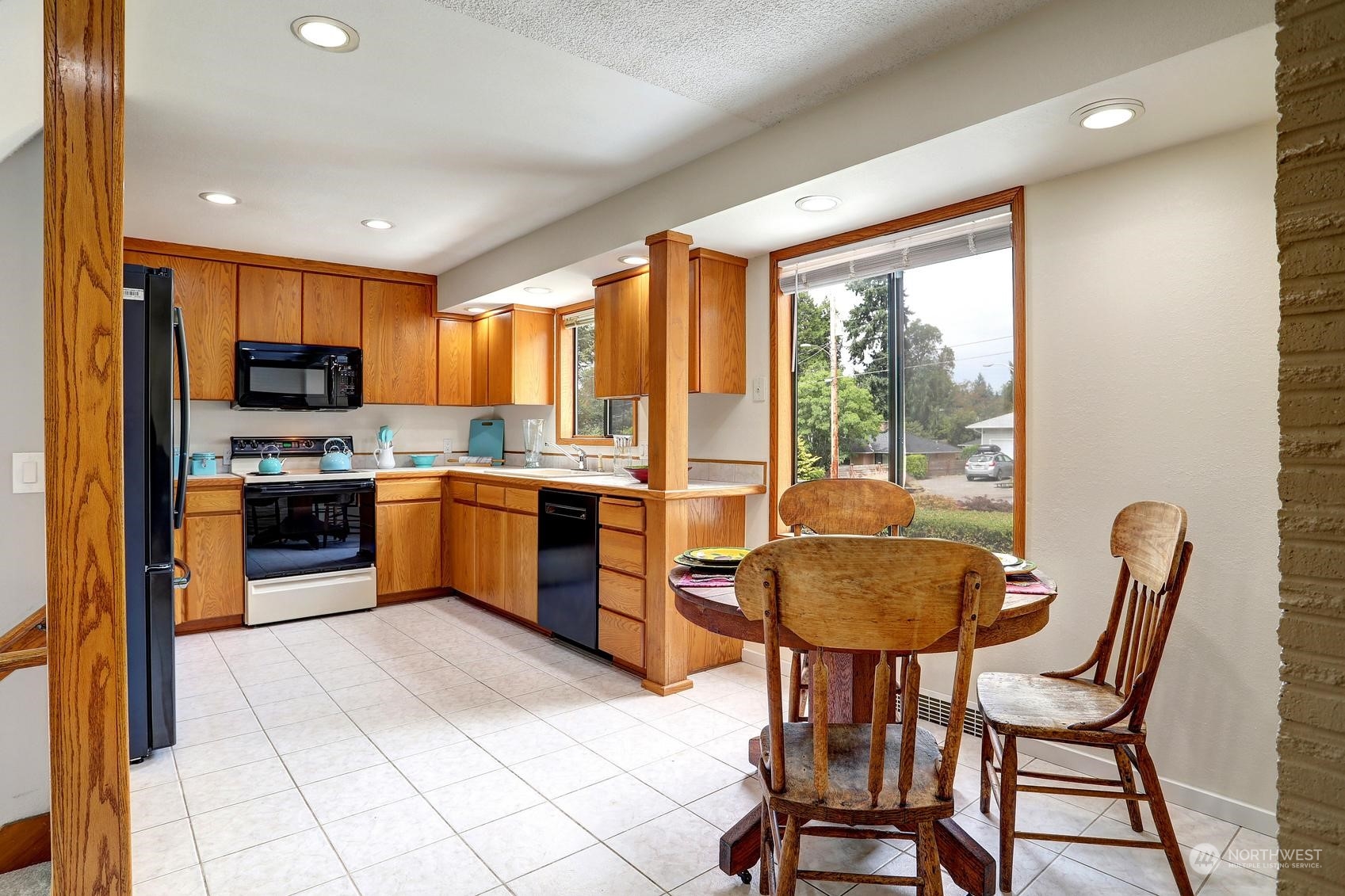 237 South 197th Street Des Moines, WA 98148 - Photo 9 of 29 a kitchen with granite countertop a counter space a sink appliances and cabinets